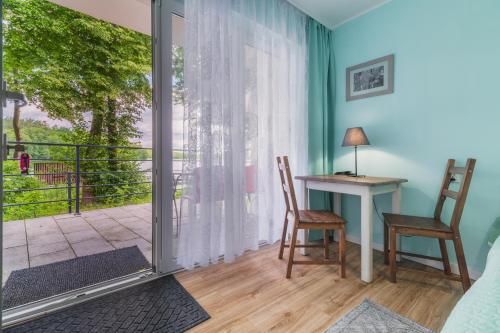 Balkón alebo terasa v ubytovaní Domki nad Brzegiem