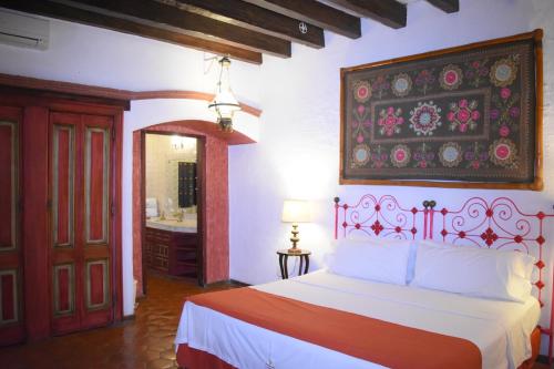 Cama o camas de una habitación en La Joyita Cuernavaca