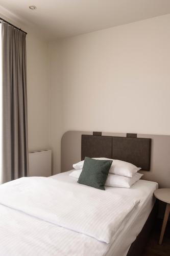 Postel nebo postele na pokoji v ubytování Werners Boutique Hotel