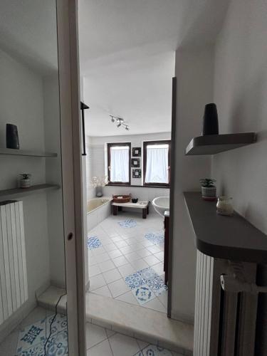 a bathroom with a tub and a toilet and a sink at Lucy house in Ronciglione