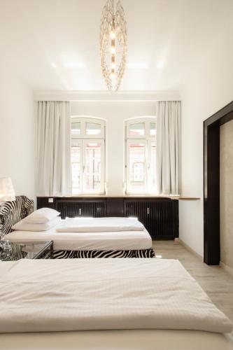 Postel nebo postele na pokoji v ubytování Werners Boutique Hotel