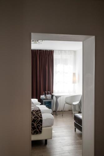 Postel nebo postele na pokoji v ubytování Werners Boutique Hotel
