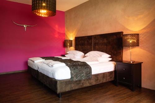 Postel nebo postele na pokoji v ubytování Werners Boutique Hotel
