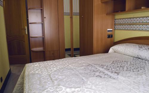 Ένα ή περισσότερα κρεβάτια σε δωμάτιο στο Casa Del Sol y la Luna Apartamento Medio Día