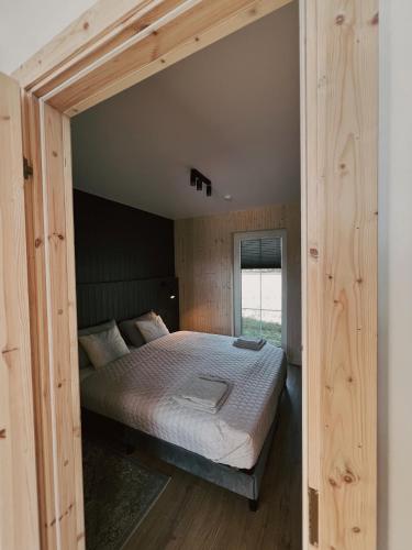 a bedroom with a large bed in a room at Storm Villas in Sturmai