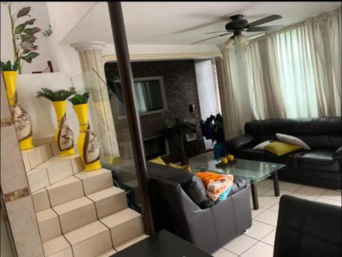 a living room with a couch and a table at Alojamiento La buena estancia! in Santa Cruz de las Flores