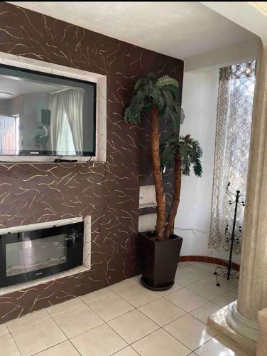 a living room with a fireplace and a tv at Alojamiento La buena estancia! in Santa Cruz de las Flores