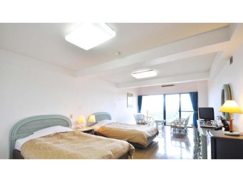 Giường trong phòng chung tại Umibe no Kajuen - Vacation STAY 17477v