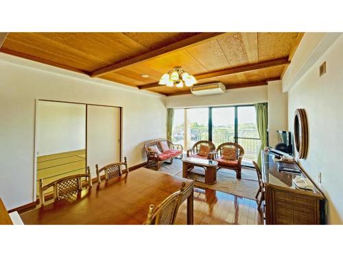 a living room with a ping pong table and a dining room at Umibe no Kajuen - Vacation STAY 17483v in Konan