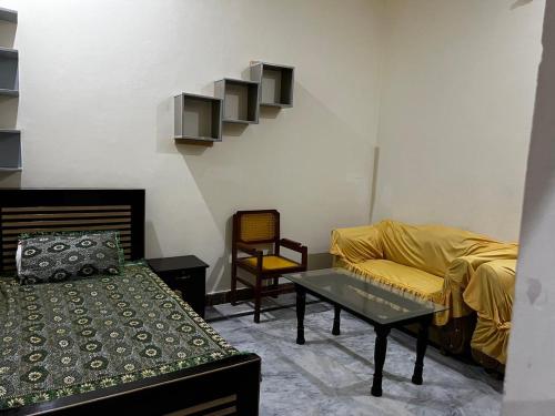 a living room with a couch and a table at House for Short Term Renting in Sargodha