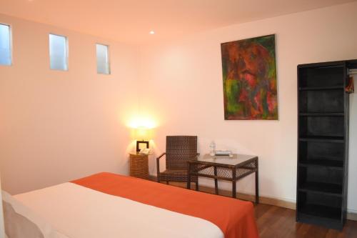 Cama o camas de una habitación en La Joyita Cuernavaca