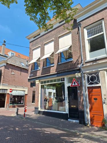 a brick building on a city street at B&B Lange Geer Delft in Delft
