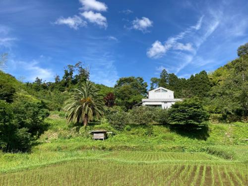 a white house in the middle of a field at Kinta-Garden - Vacation STAY 20753v in Kanō