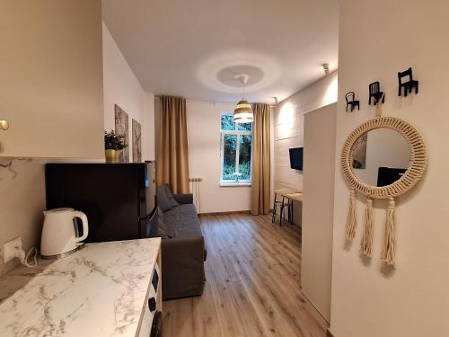 Katil atau katil-katil dalam bilik di Apartamencik Zofiówka