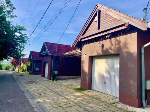 a row of houses on the side of a street at Luxury Villa with Pool close to the Hungaroring in Kerepes