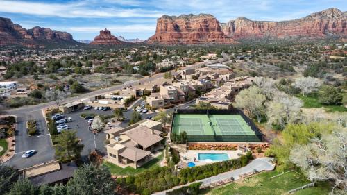 an aerial view of a home with a tennis court at Stylish Townhome on Golf Course Red Rock View in Sedona