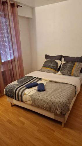 a large bed in a room with at Chambre Jardin 1 in Vaujours