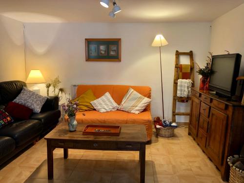 a living room with a couch and a coffee table at Casa Luka Etxea in Zábal