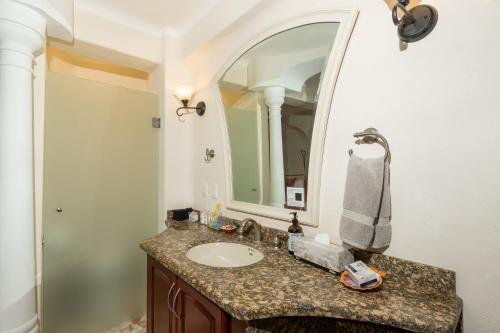 a bathroom with a sink and a mirror at Ocean Front, With Pool, 6 People, Quinta del Mar PH502 in Bucerías