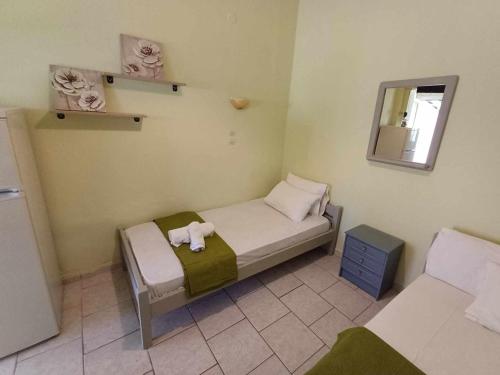 Ein Bett oder Betten in einem Zimmer der Unterkunft Ta Spitakia Olympiada