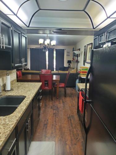 a kitchen and living room with a dining room at Lakeside Lake Biltmore Village Condo in Phoenix