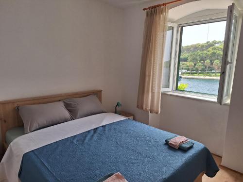 Ένα ή περισσότερα κρεβάτια σε δωμάτιο στο Apartments Neptun