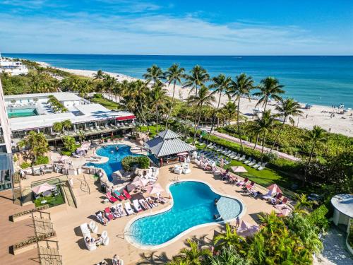 an aerial view of a resort with a pool and the beach at 2 Bedrooms Unit OceanFront Resort The Alexander in Miami Beach