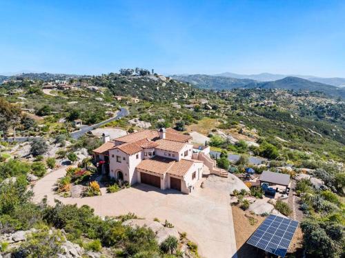 an aerial view of a house with a solar array at Mediterranean Haven with Views in Escondido in Escondido