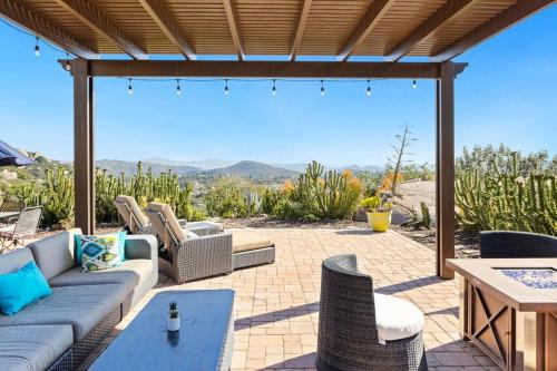 a patio with a couch and chairs and a table at Mediterranean Haven with Views in Escondido in Escondido