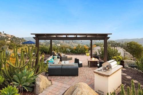 a patio with a couch and a gazebo at Mediterranean Haven with Views in Escondido in Escondido
