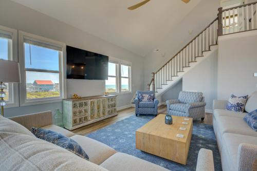 a living room with a couch and a table at HartSea in North Topsail Beach