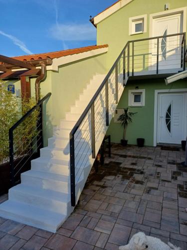 a stairway leading up to a house at Apartman Hana 1 in Žgaljić