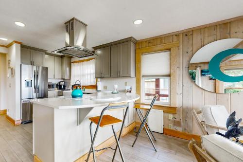 a kitchen with a white counter top and wooden walls at Bells Beauty in Langley