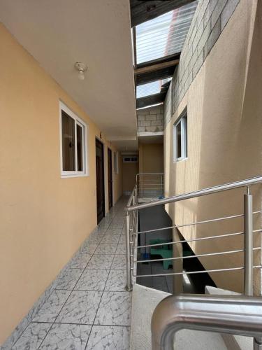 an empty hallway of a building with a balcony at Casa Julia Xela in Quetzaltenango