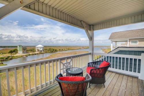 a porch with chairs and a view of the water at Knot Fade Away in North Topsail Beach