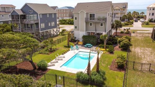 an aerial view of a house with a swimming pool at Beyond the Sea in Thomas Landing