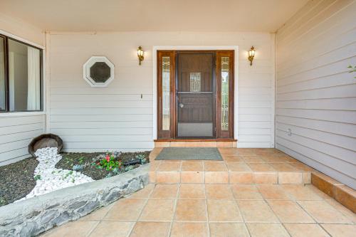 a front door of a house with a brick walkway at Secluded Waimea Hideaway with Lanai and Views! in Waimea