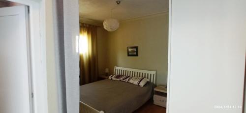 a bedroom with a bed with two pillows on it at Apartmani Isabela sa terasom in Zagrađe