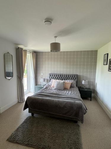 Postel nebo postele na pokoji v ubytování Boundary Cottage