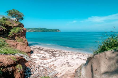 a beach with the ocean in the background at Casa Gracias in Punta Mita