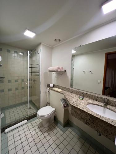 a bathroom with a toilet and a shower and a sink at Hotel Live Lodge V Mariana pq Ibirapuera UH813 in Sao Paulo