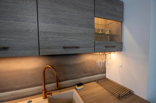 a kitchen with a sink and a counter top at Aurelia - Cosy & Chic - 10min Disney - by Cosynousvoici in Chessy