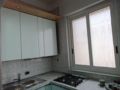 Kuchyň nebo kuchyňský kout v ubytování Luca's House