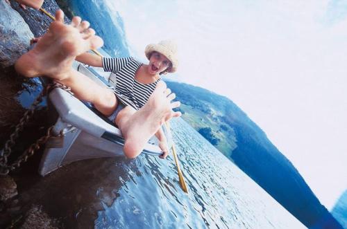 a woman sitting on a raft in a water slide at Gästehaus Waldruh in Gerlos