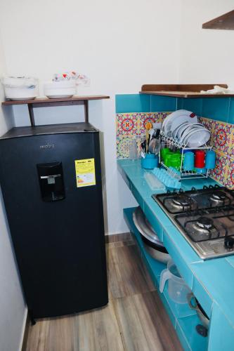 Dapur atau dapur kecil di Eco Hotel Campestre Atlantis San Joaquín La Mesa