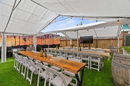 a tent with a table and chairs under it at Good Life Resorts in San Diego