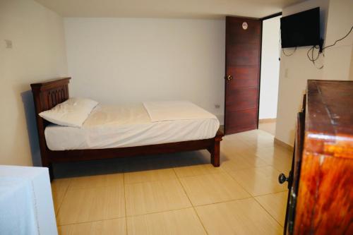 Katil atau katil-katil dalam bilik di Eco Hotel Campestre Atlantis San Joaquín La Mesa