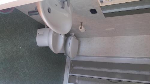 a bathroom with a toilet and a sink at LeonessAffittacamere in Leonessa