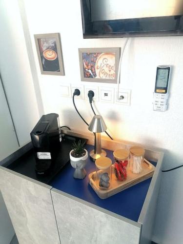 a desk with a coffee maker and a printer at Irini&Stefanos Toroni, Greece in Toroni