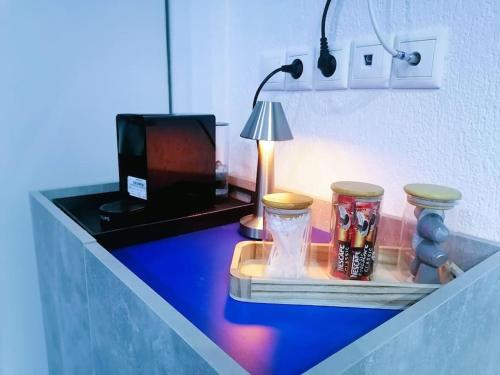 a room with a desk with a lamp and a table with a lamp at Irini&Stefanos Toroni, Greece in Toroni